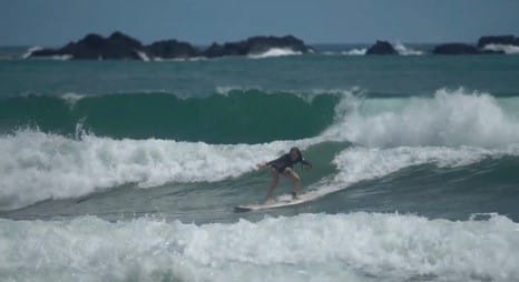 Girl surfing in Costa Rica