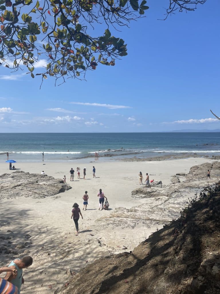 White sand beach with people