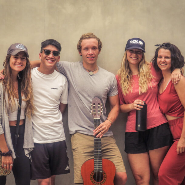 Students leaning against a wall