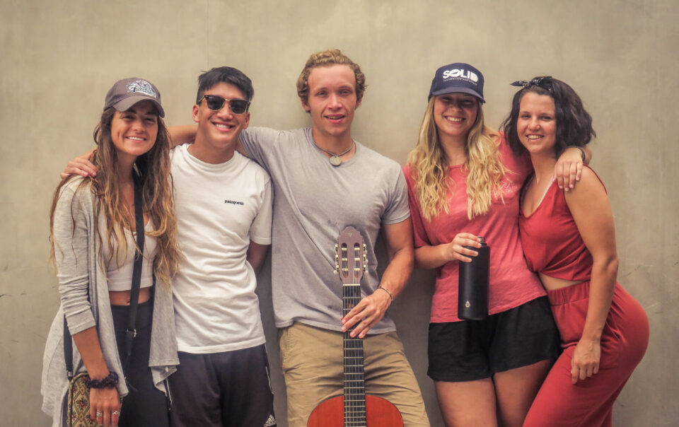 Students leaning against a wall