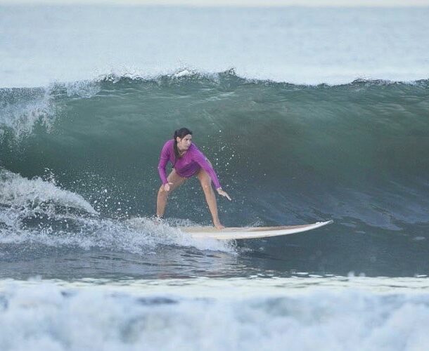 Girl surfing on a wave