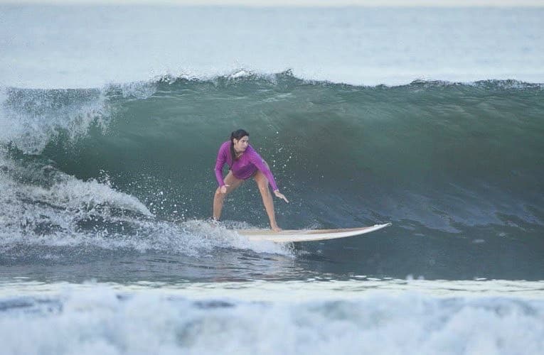 Girl surfing on a wave